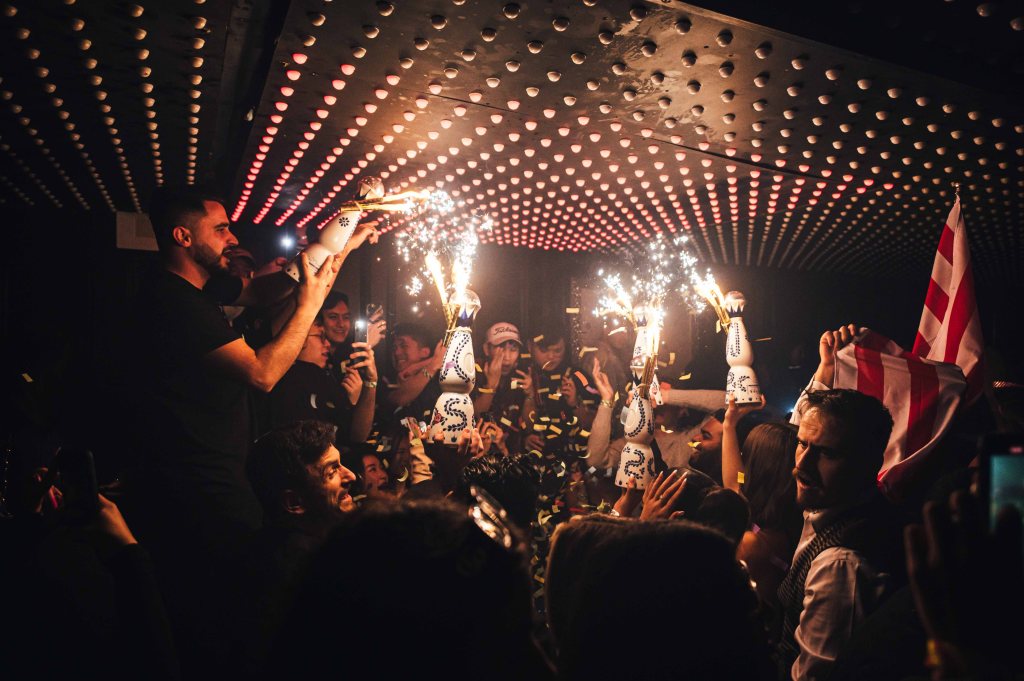 A luxury champagne show at the VIP section inside Tape London, one of the best clubs to celebrate a big promotion in London.