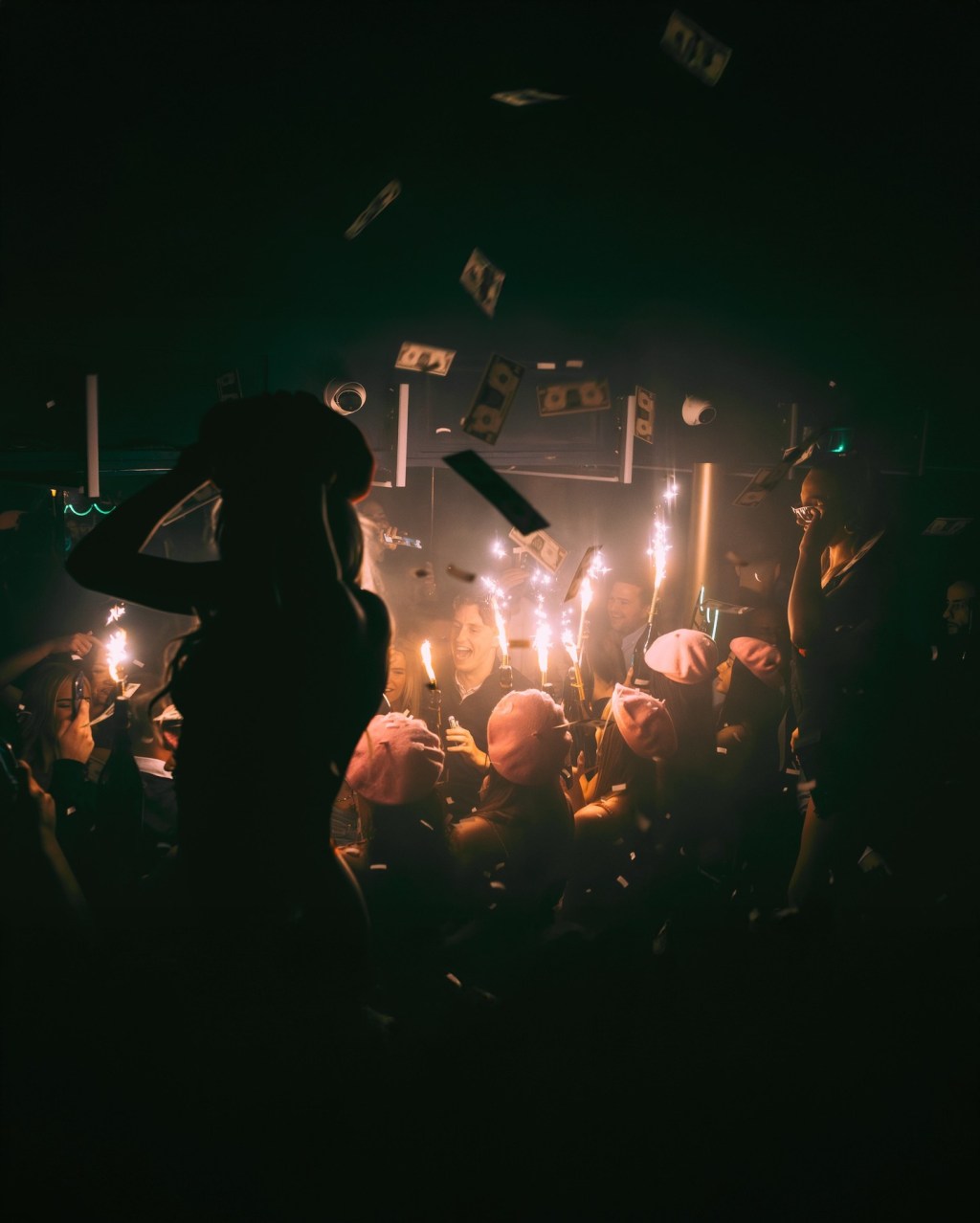 Guests celebrating with a champagne show at Reign Showclub.