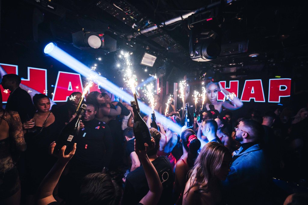 A champagne show at Tape London, one of the best places to party near Park Lane, London.