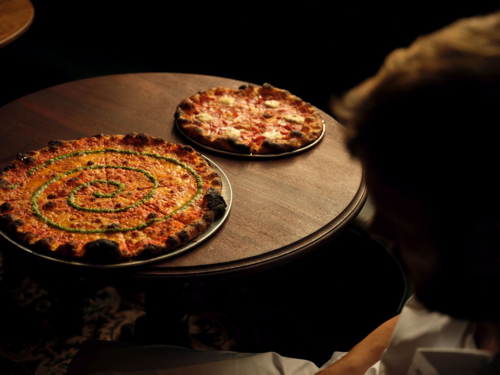 Pizza on a table at Crisp Pizza at The Marlborough